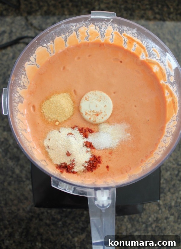 creamy sauce with spices in a food processor