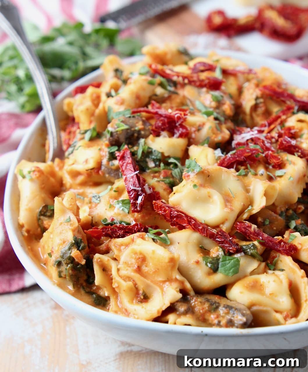 One Pot Vegetarian Pesto Tortellini Recipe 3 Pesto tortellini with sun dried tomatoes in bowl with spoon