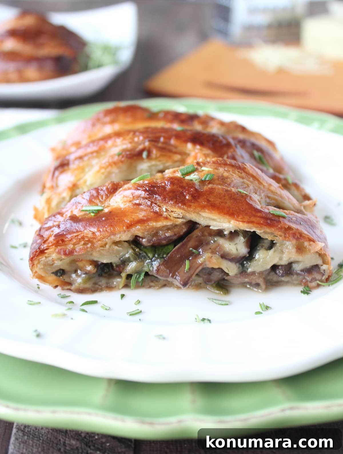 filled puff pastry with cheese, mushrooms and spinach on plate