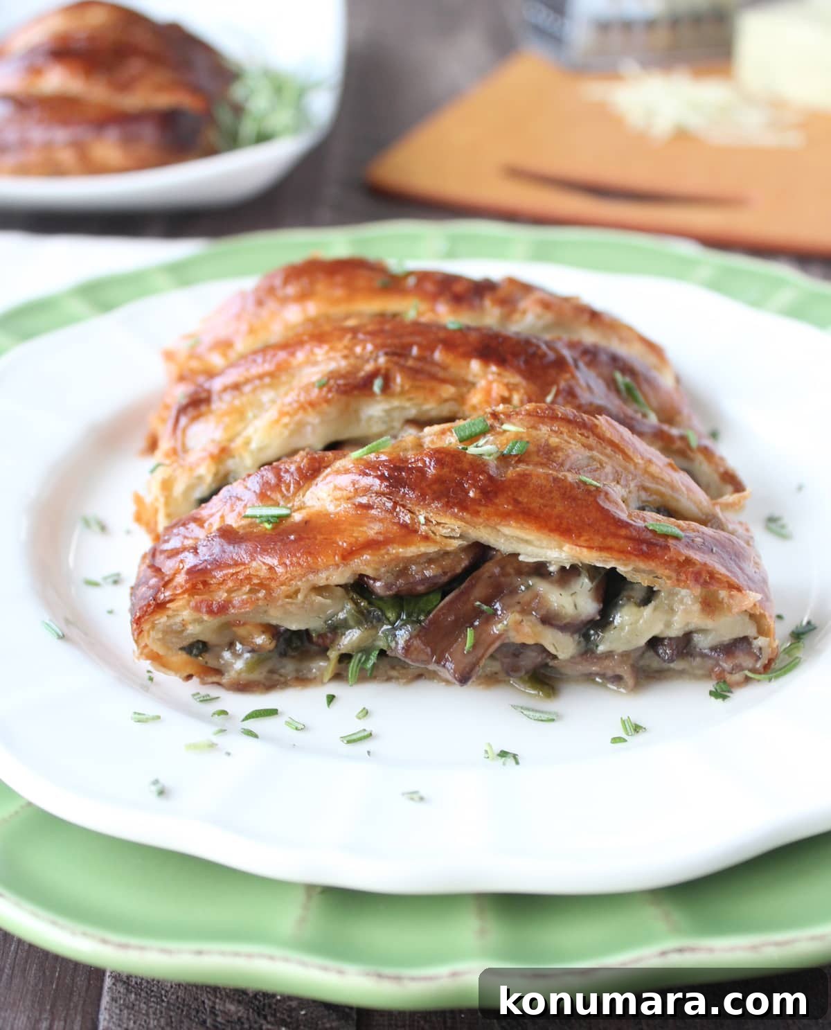 slices of mushroom spinach puff pastry on plate