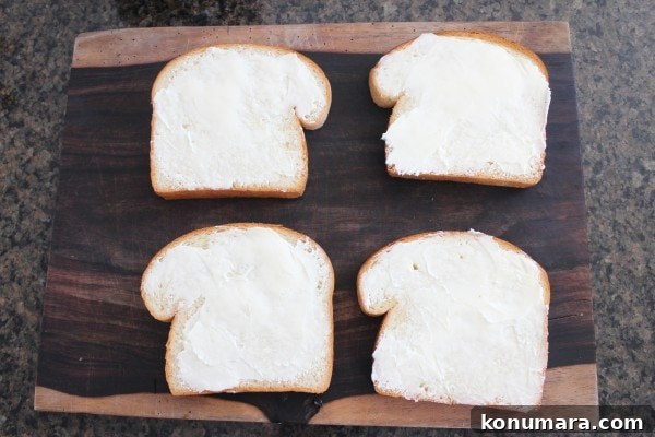 buttered bread on a wood cutting board