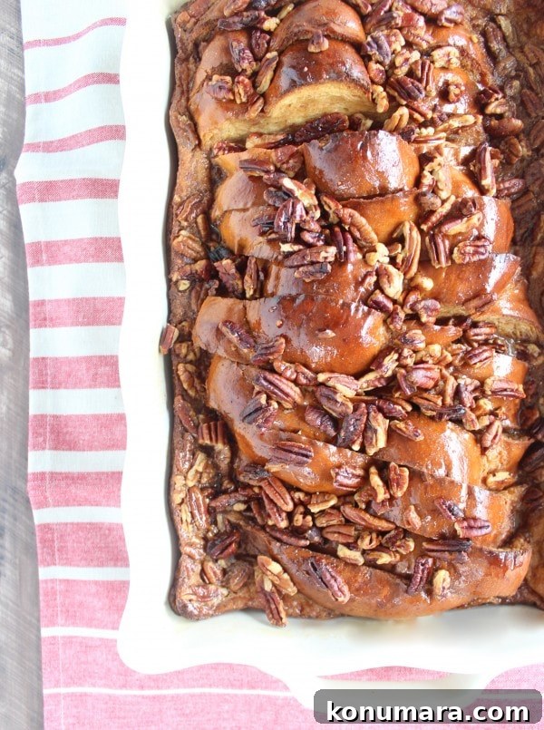 Salted Caramel Praline French Toast Recipe 2 Salted Caramel Praline French Toast in a white casserole dish.
