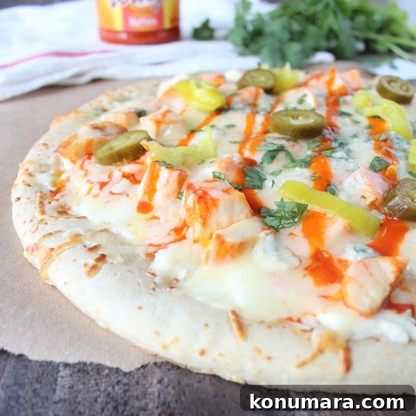 Buffalo Chicken Dip Pizza Recipe 9 Pizza topped with melted cheese, chicken, buffalo sauce, pepperoncinis, and jalapeños.