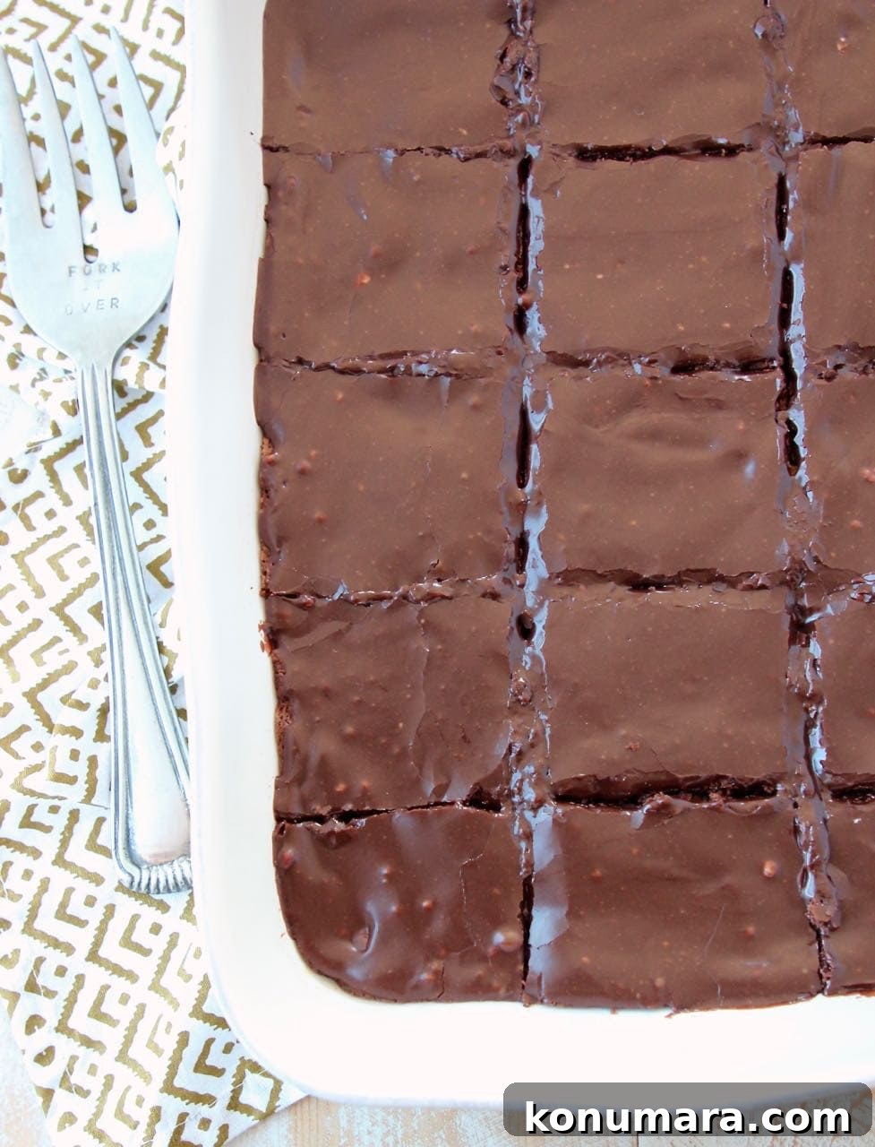 Chocolate brownies in baking dish, sliced into squares