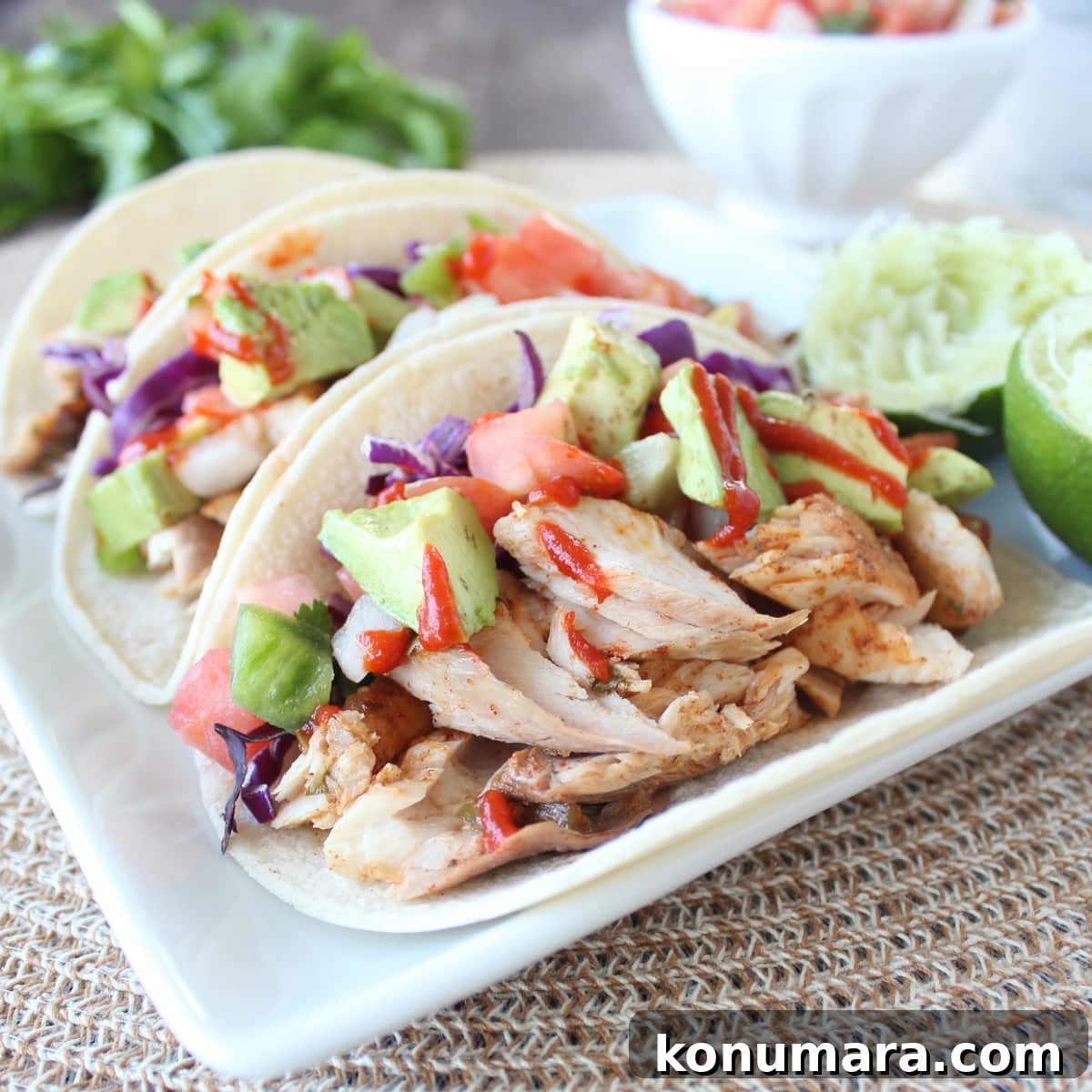 Grilled Mahi-Mahi Tacos with Avocado Lime Slaw 8 grilled mahi mahi tacos on plate with limes