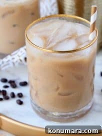 Long Island drink with coffee in glasses with gold and white striped straws
