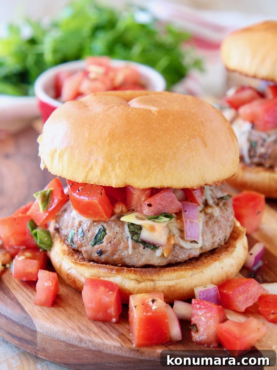 Bruschetta Turkey Burgers with Tomato and Basil 4 Turkey burger with tomato bruschetta on wood cutting board