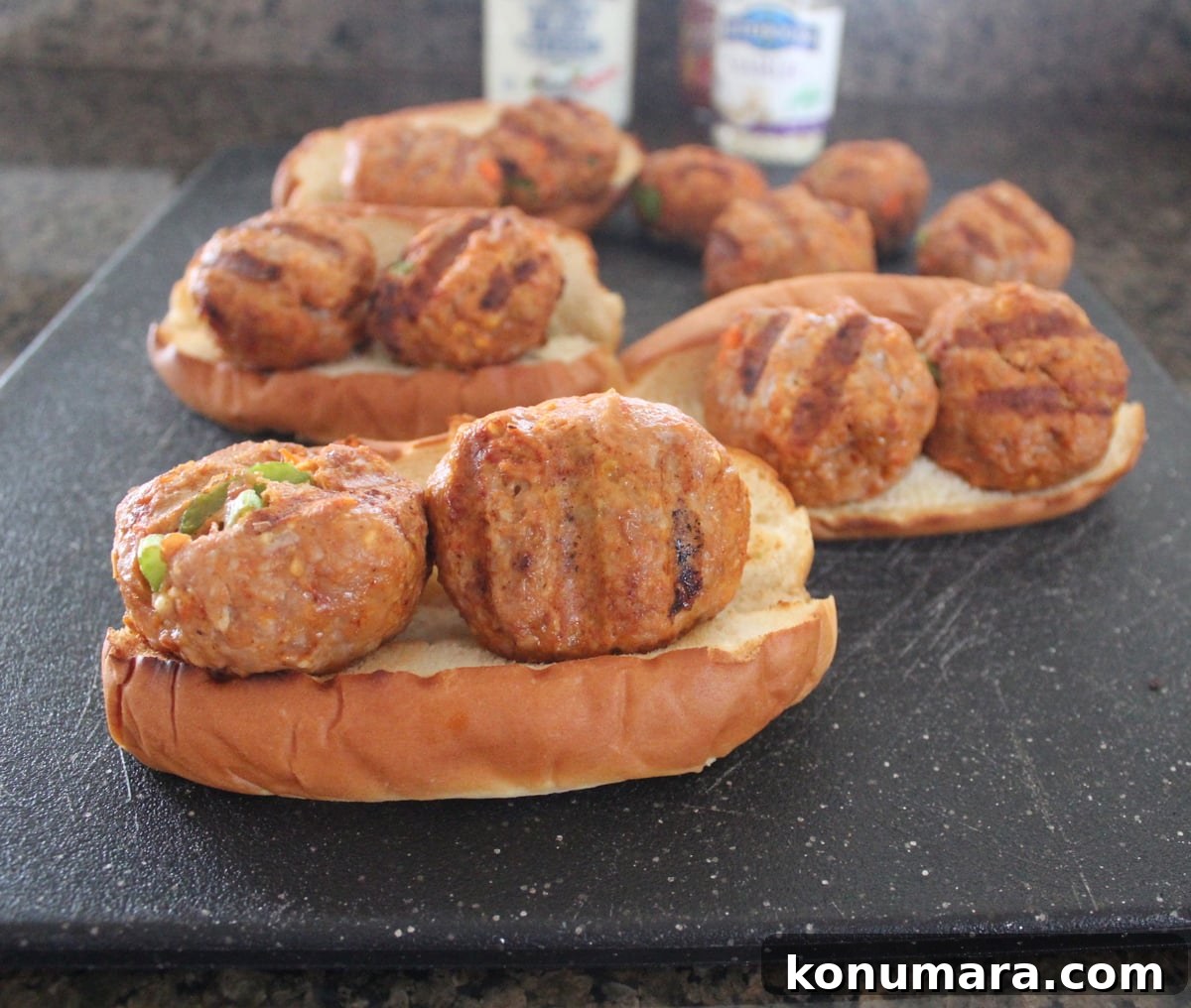 Grilled Buffalo Turkey Meatballs on a hot dog bun