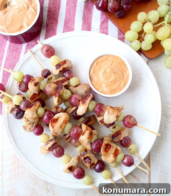 Skewers of marinated chicken & grapes are served with creamy peanut sauce in this Peanut Butter and Jelly Chicken Skewer recipe that's both fun & delicious!