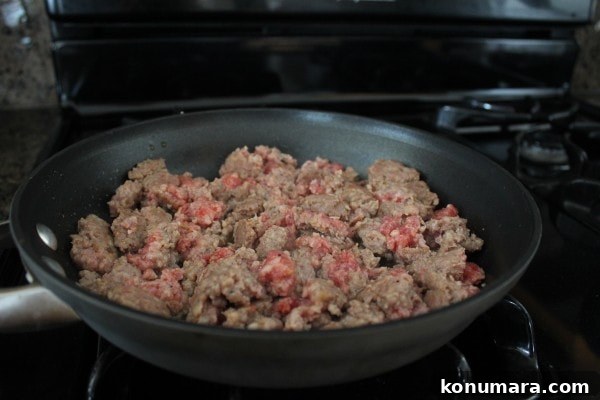 crumbled sausage in a skillet on the stove