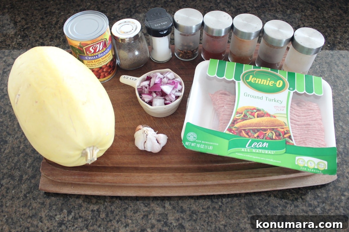 Turkey Chili Spaghetti Squash Recipe Ingredients on a wood board