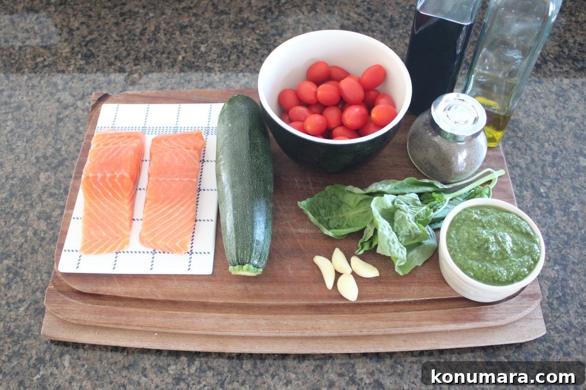 Pesto Baked Salmon Recipe Ingredients on a wood board