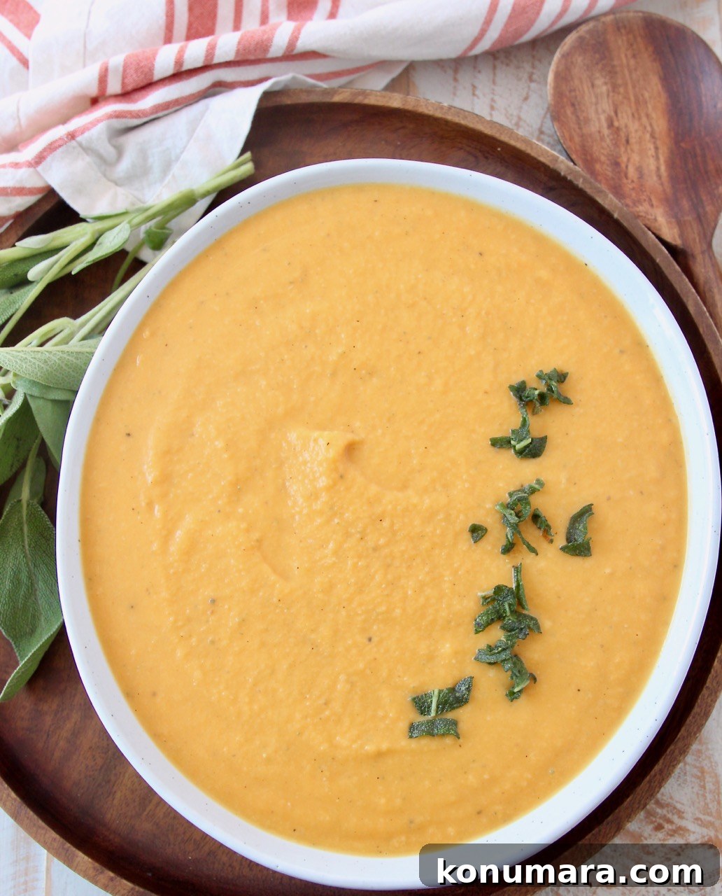 butternut squash sauce in bowl topped with fried sage