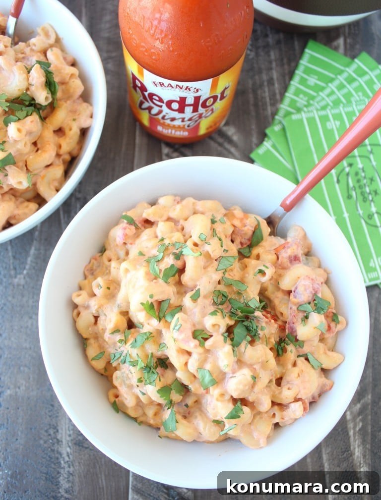 macaroni and cheese in white bowl with orange fork