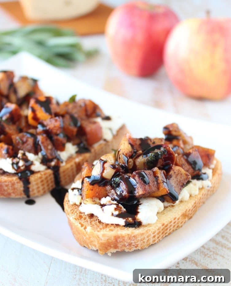 Roasted Butternut Squash and Apple Bruschetta 13 roasted diced butternut squash on top of ricotta cheese on sliced bread, drizzled with balsamic glaze, on white plate