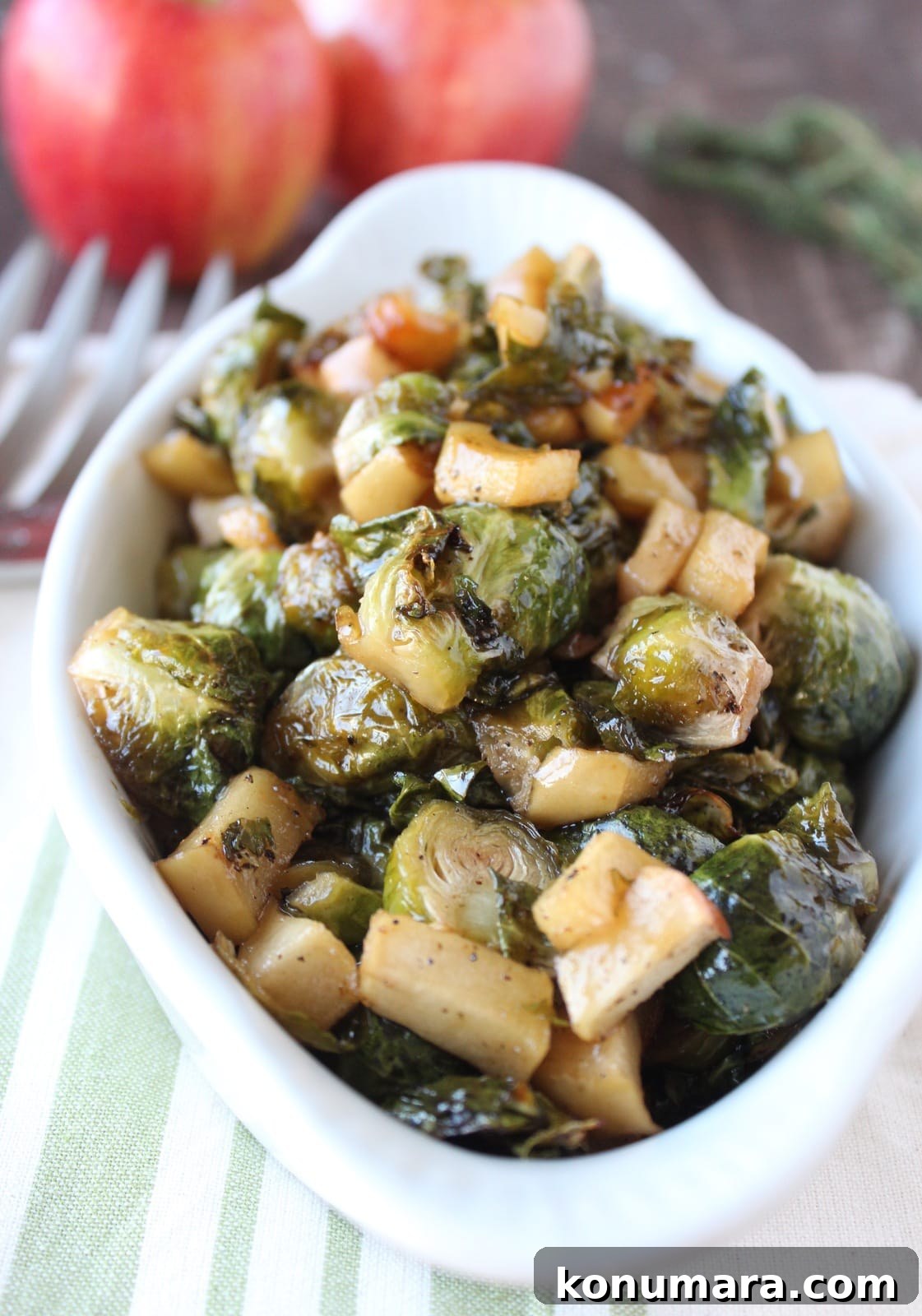 Crispy Maple-Glazed Roasted Brussels Sprouts 2 roasted brussels sprouts and apples in serving dish