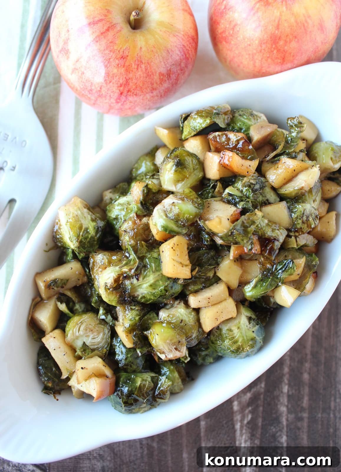 Crispy Maple-Glazed Roasted Brussels Sprouts 6 roasted brussels sprouts and diced apples in serving dish