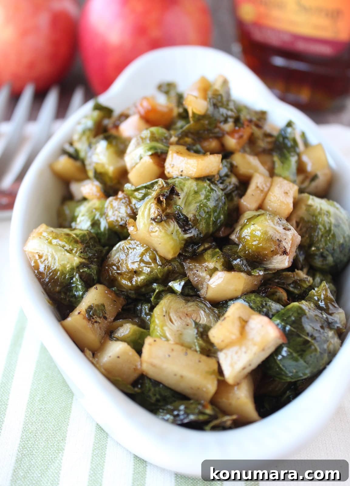 Crispy Maple-Glazed Roasted Brussels Sprouts 8 roasted brussels sprouts and diced apples in serving dish