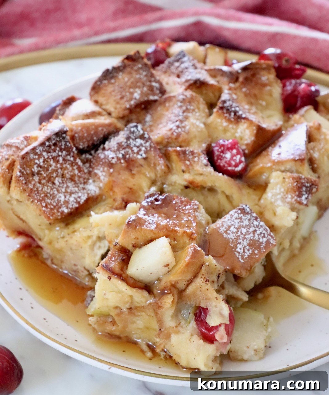 piece of french toast bake on a plate with a fork