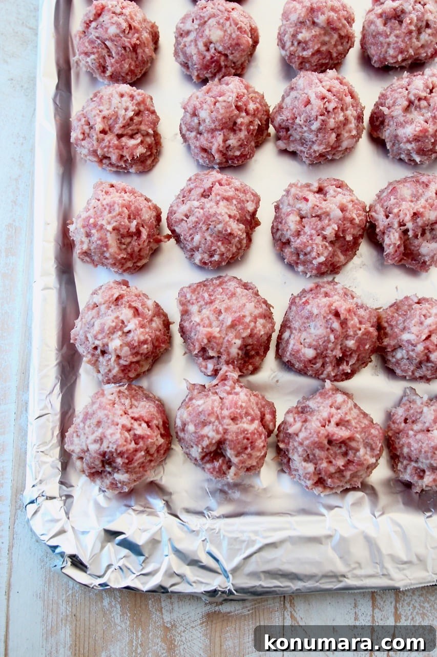 Chinese pork meatballs on foil lined baking sheet