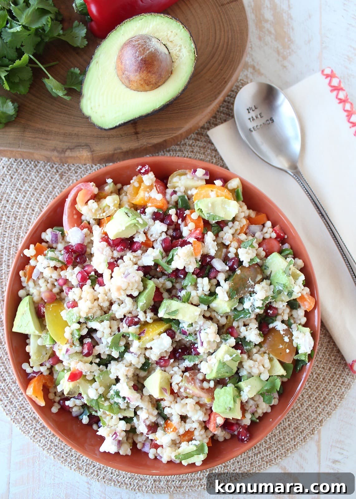 Israeli Couscous and Avocado Salad with Lemon Vinaigrette 6 couscous tossed with fresh vegetables in orange bowl