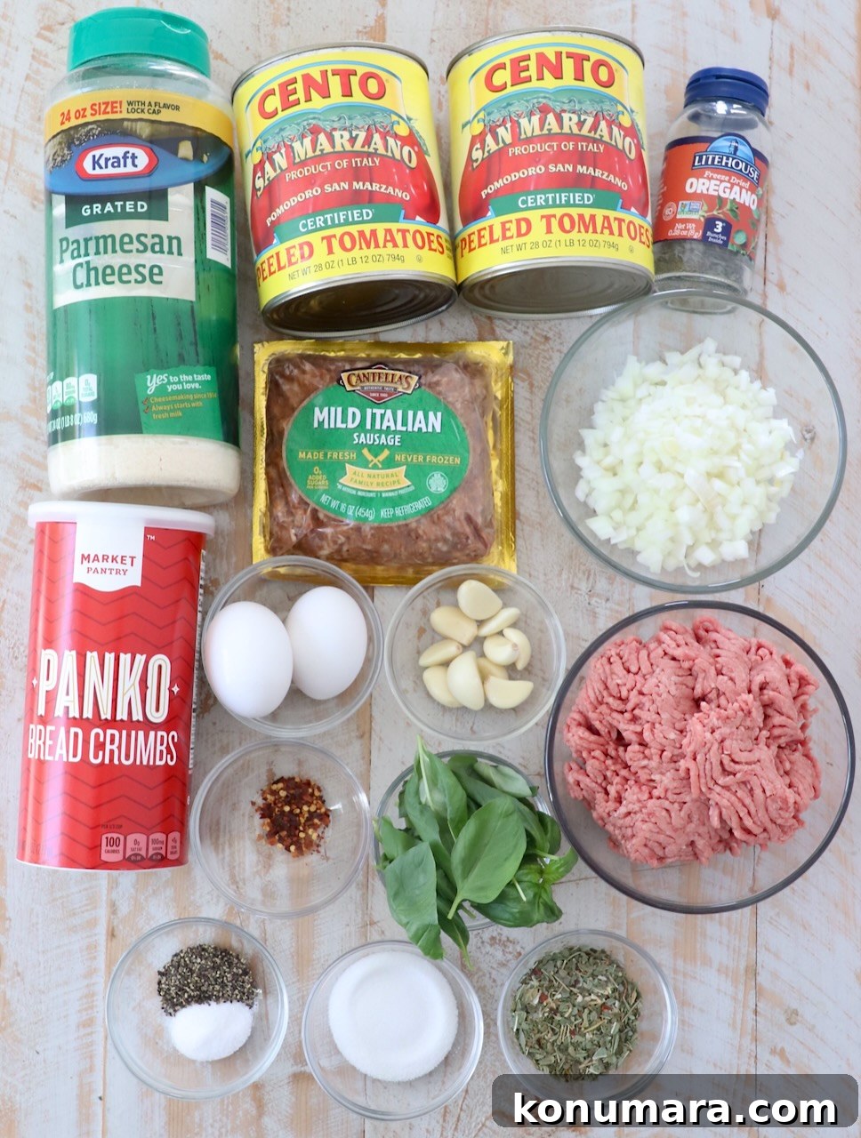 Slow Cooker Meatballs with Marinara Sauce Recipe 3 ingredients for slow cooker meatballs and marinara sauce on white wood board