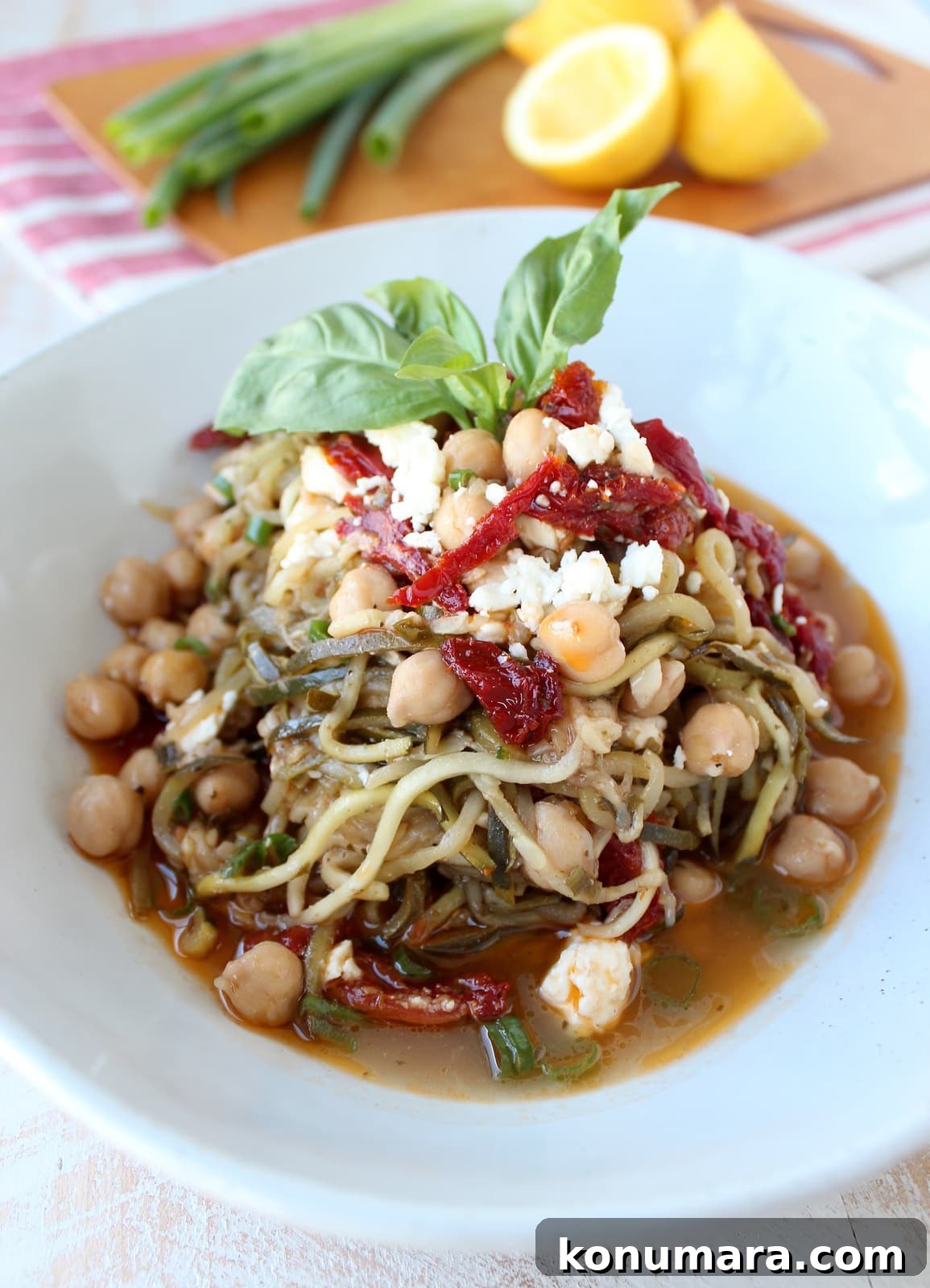 Greek Zucchini Noodles with Feta and Olives 6 Greek Zucchini Noodles in a bowl with feta cheese and sun dried tomatoes