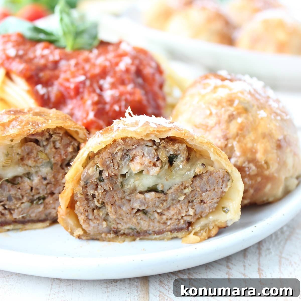 meatball wellington cut in half on plate
