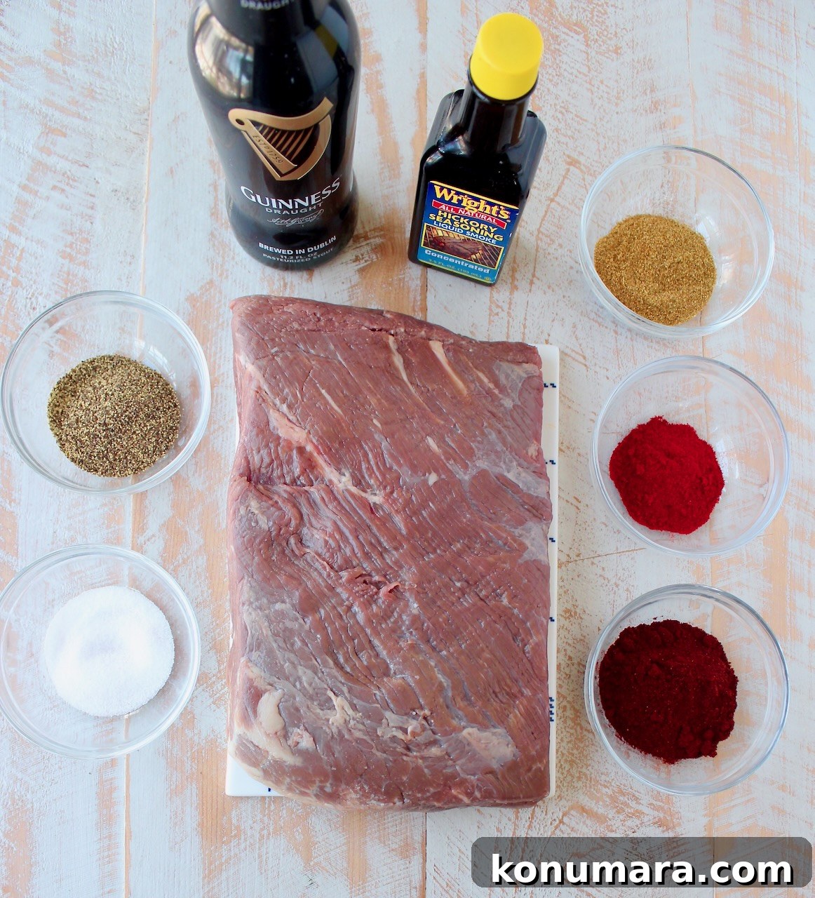 Slow Cooker Smoky Chipotle Brisket Tacos 3 ingredients for brisket tacos on a white wood board