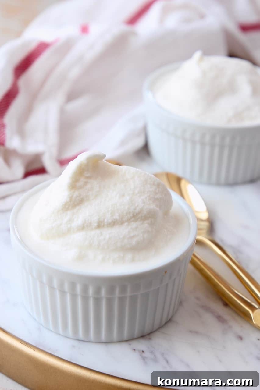 Classic Old-Fashioned Vanilla Ice Cream 7 vanilla ice cream in white bowls with gold spoons
