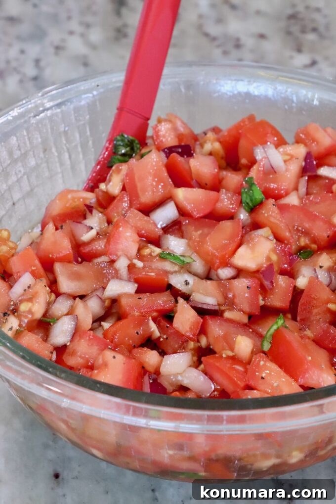 Bruschetta Chicken Recipe with Basil and Balsamic Glaze 5 tomato bruschetta mixed together in a glass bowl