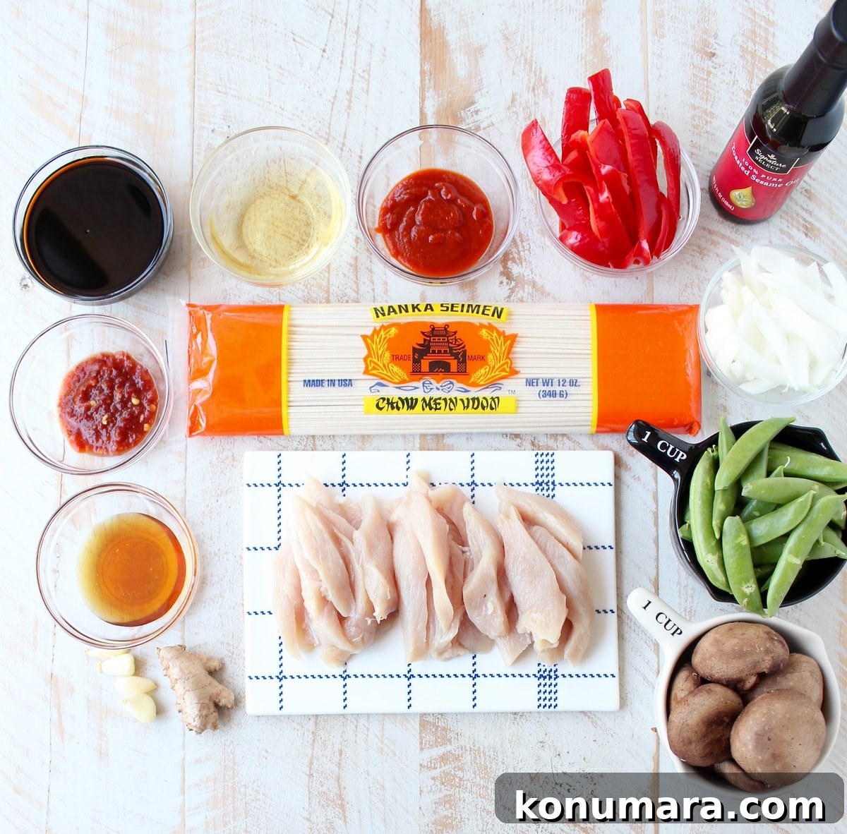 Chicken Lo Mein Recipe: Quick Weeknight Stir Fry 3 ingredients for chicken lo mein on a white wood board