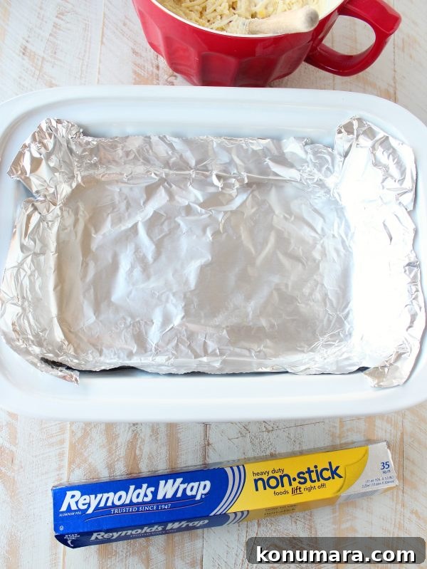 Cornbread batter smoothed in crock pot