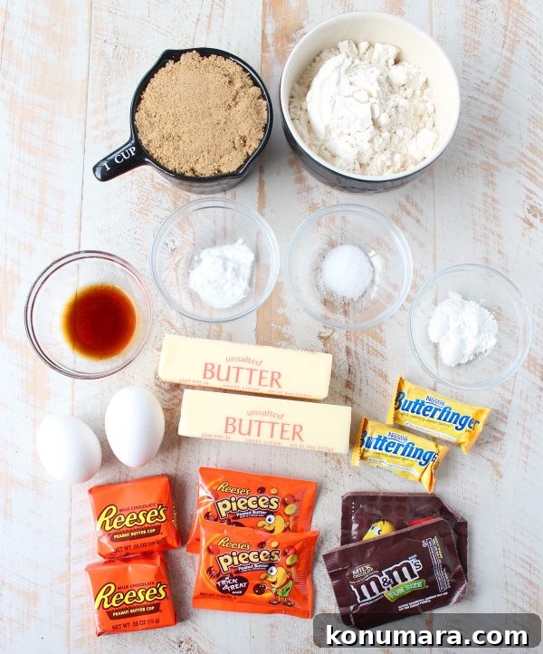 The Ultimate Candy Cookie Cake recipe is perfect for Halloween, birthdays or holidays, add your favorite candy to cookie dough & bake into a tasty cake!