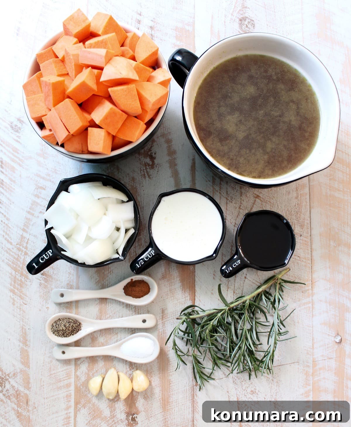 Creamy Roasted Sweet Potato Soup Recipe 3 ingredients for sweet potato soup on a white wood board