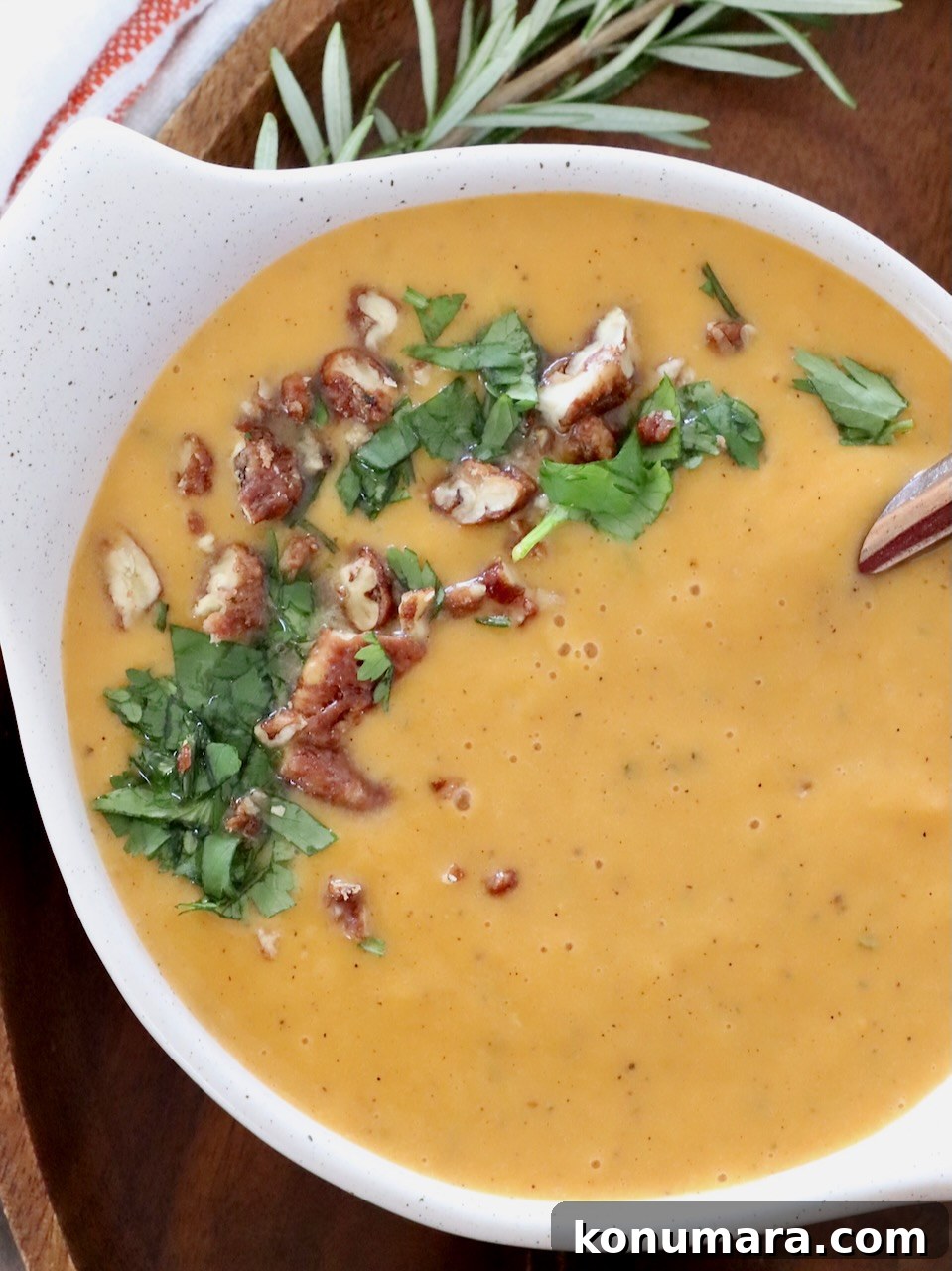 Creamy Roasted Sweet Potato Soup Recipe 6 sweet potato soup in a bowl topped with chopped pecans and parsley
