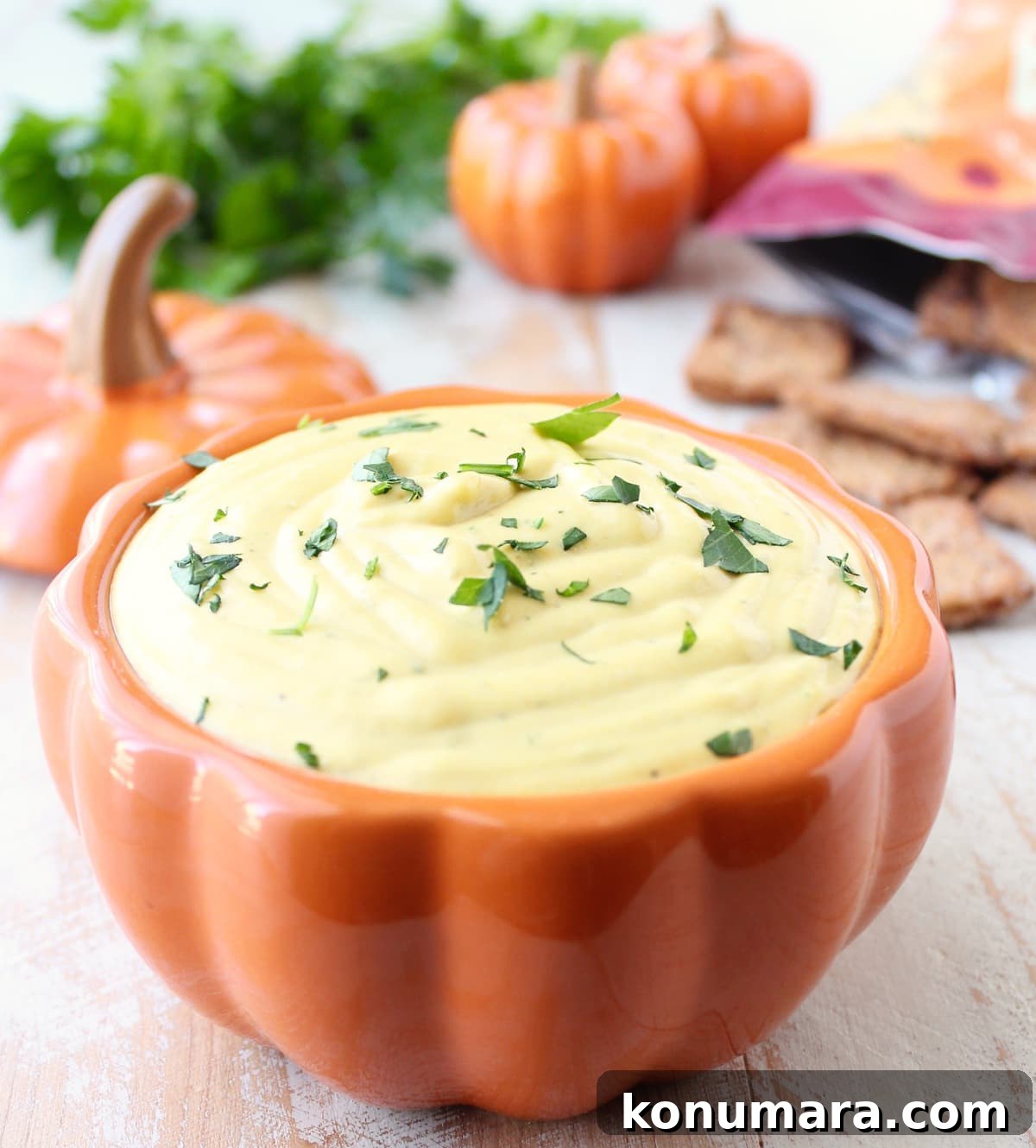 Spicy Jalapeño Pumpkin Dip Recipe 2 creamy pumpkin dip in an orange pumpkin shaped dish