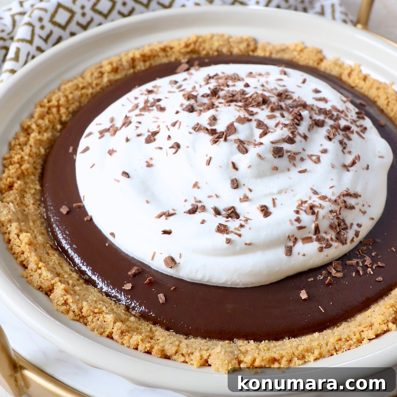 15 Thanksgiving Recipes to Impress Your Holiday Guests 12 chocolate pie topped with whipped cream in pie plate