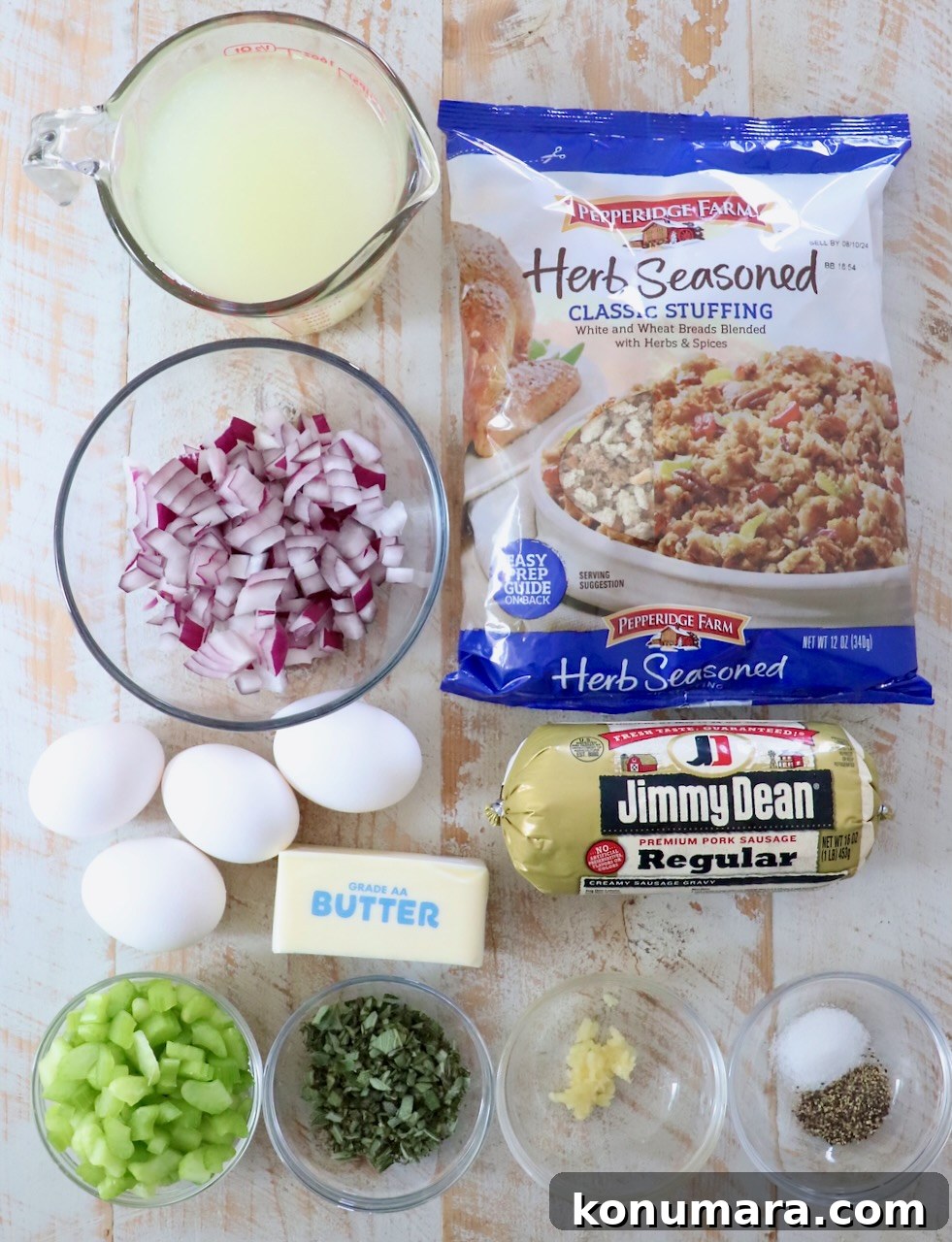 Savory Sausage Stuffing Recipe with Herbs 3 ingredients for sausage stuffing on a white wood board