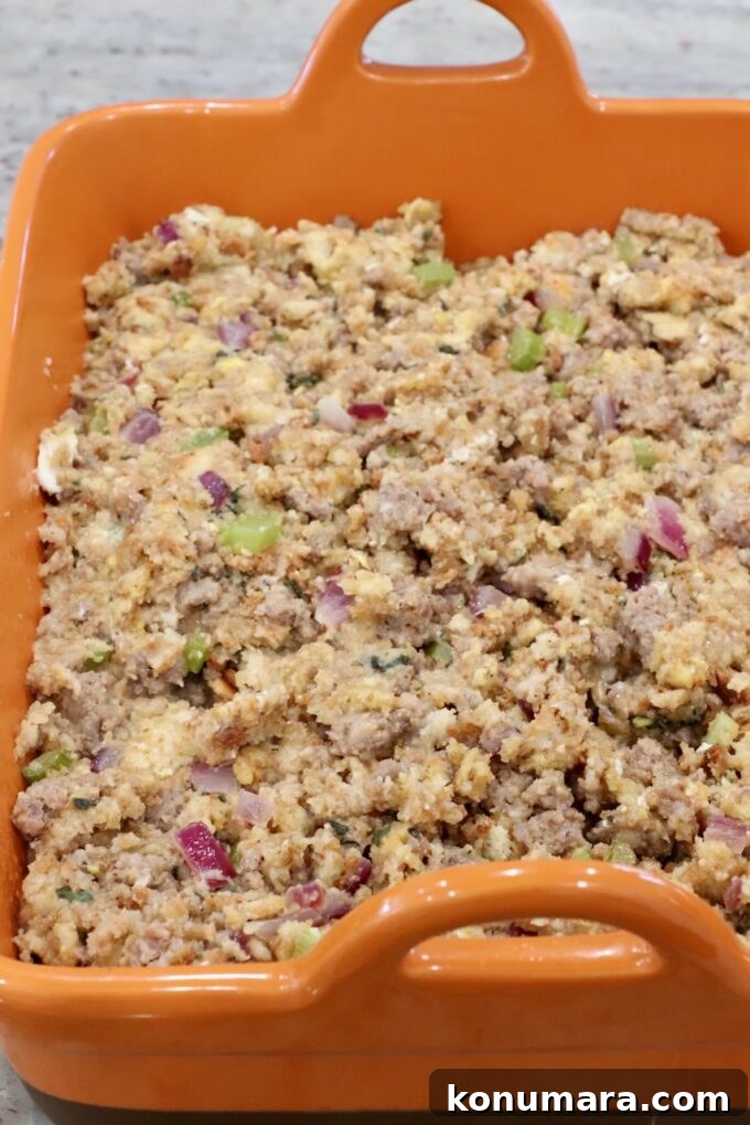 Savory Sausage Stuffing Recipe with Herbs 9 uncooked sausage stuffing in a casserole dish