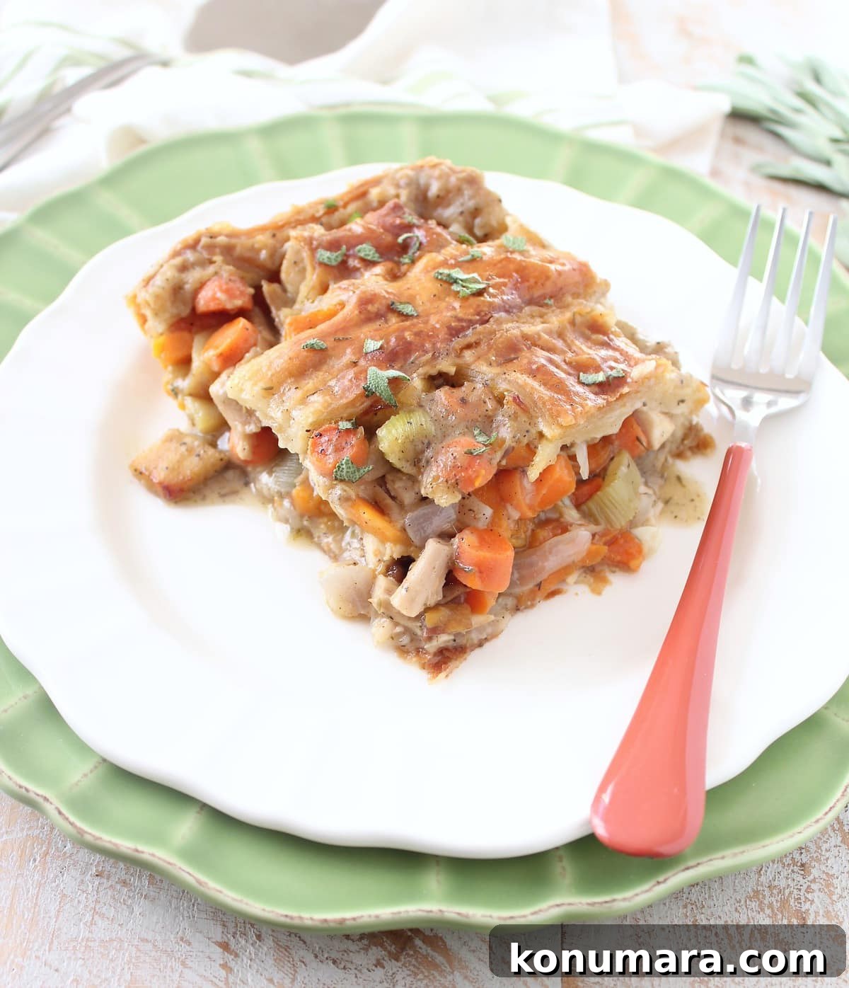 slice of turkey pot pie on a plate with a fork