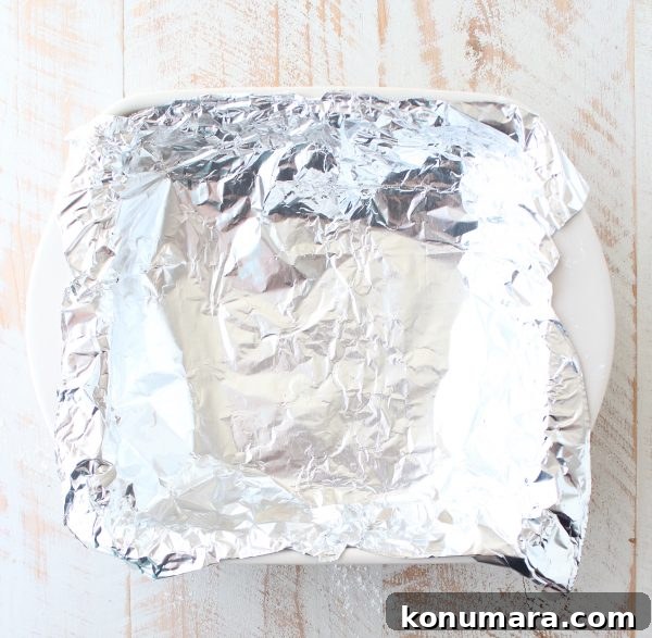 foil pressed into a square baking dish