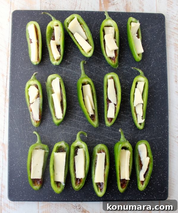 Bacon jam and triple crème cheese fill fresh jalapeños in this delicious and easy jalapeño poppers recipe, perfect for a dinner or party appetizer!