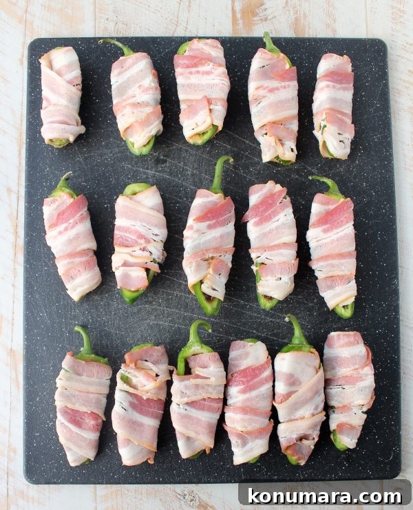 Bacon jam and triple crème cheese fill fresh jalapeños in this delicious and easy jalapeño poppers recipe, perfect for a dinner or party appetizer!