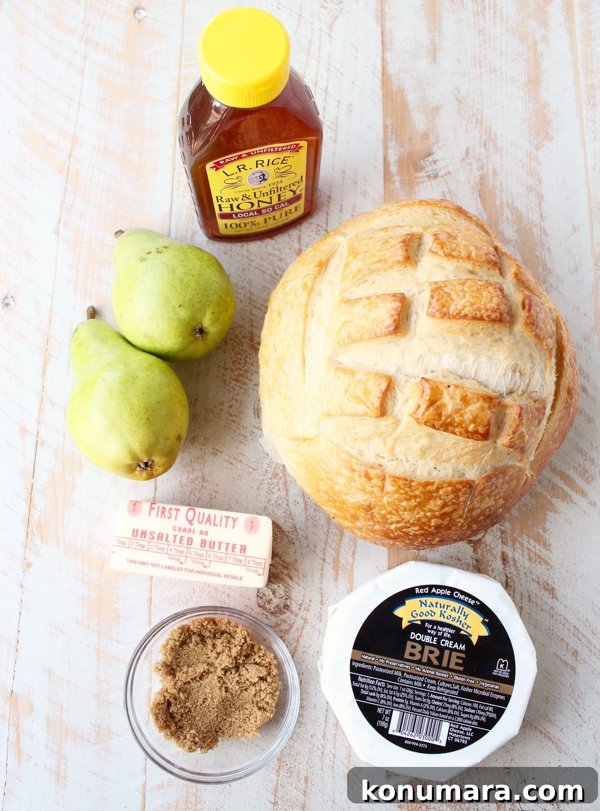 Baked brie sourdough bread bowl ingredients, honey, pears, butter, brie, sourdough and brown sugar