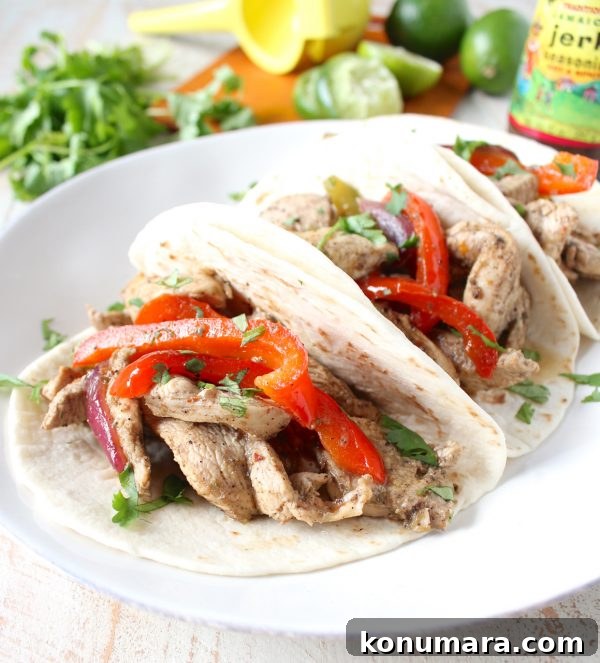 Jerk Chicken Fajitas plated - Caribbean-seasoned chicken and peppers in warm tortillas