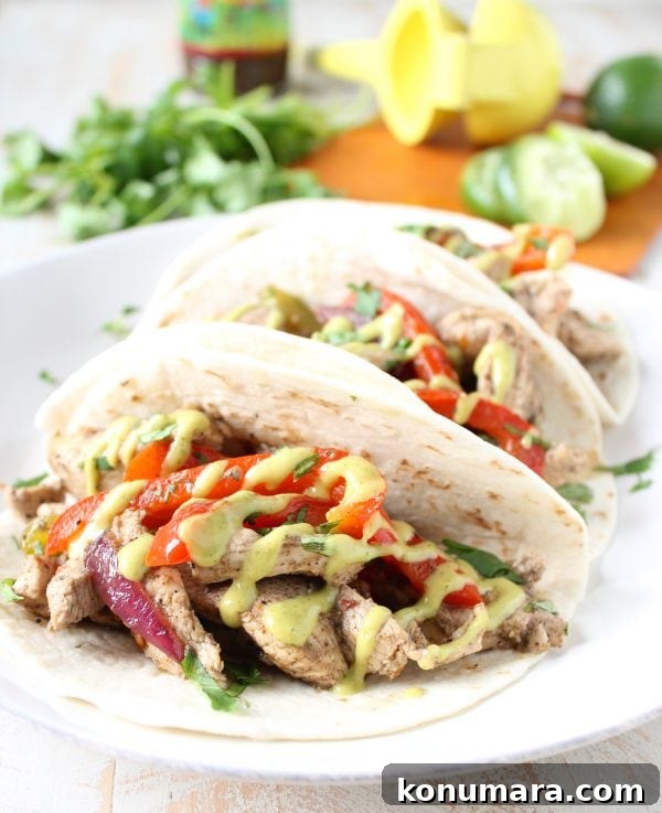 Sizzling jerk chicken fajitas in a skillet with peppers and onions