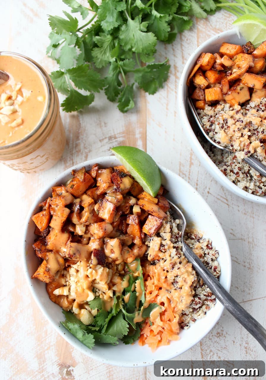 Thai Peanut Sweet Potato Buddha Bowl Recipe 3 Overhead shot of roasted sweet potatoes with quinoa and thai peanut sauce in bowls