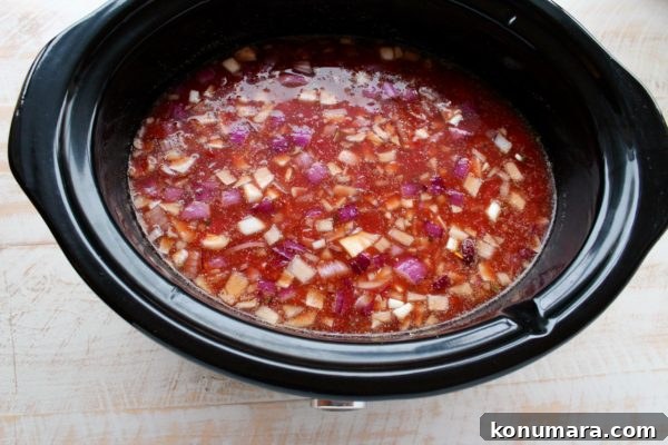 Creamy Slow Cooker Chicken Enchilada Soup 5 This Slow Cooker Chicken Enchilada Soup recipe is easy to prep in only 10 minutes & given a deliciously spicy kick with the addition of Sriracha!