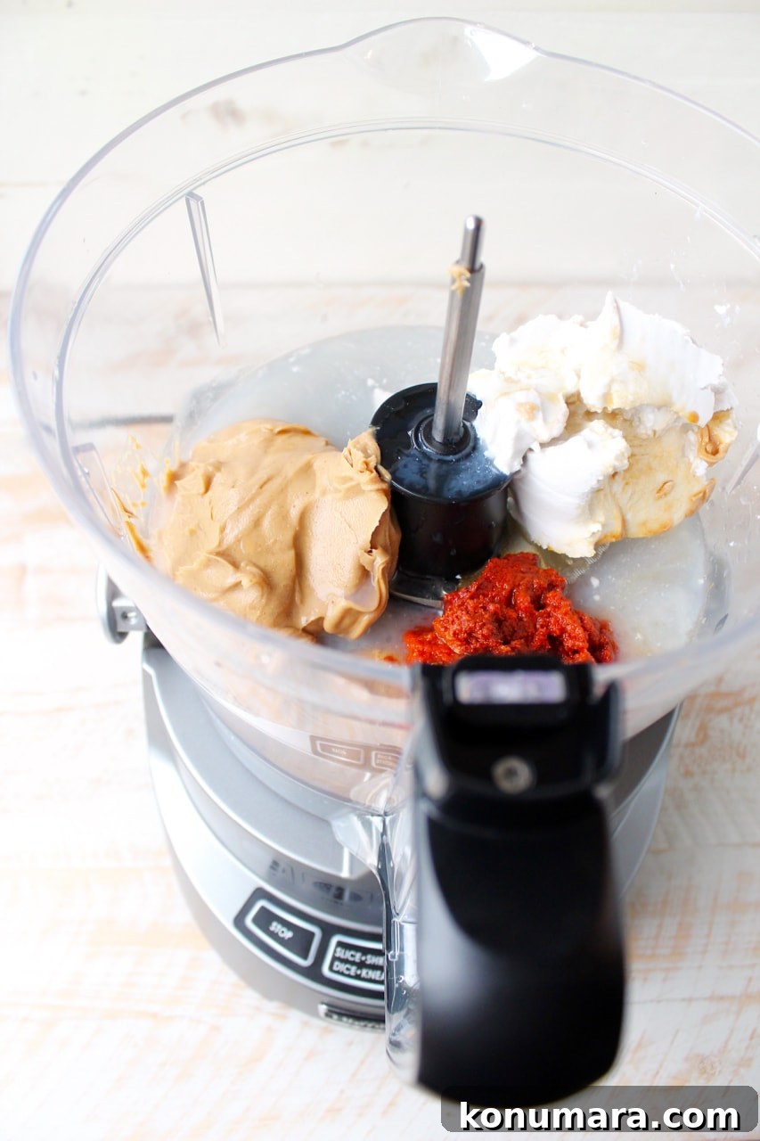 Whether you drizzle it over buddha bowls, add it to pizza or toss it with noodles, this easy 10 minute Thai Peanut Sauce recipe is sure to be a hit!